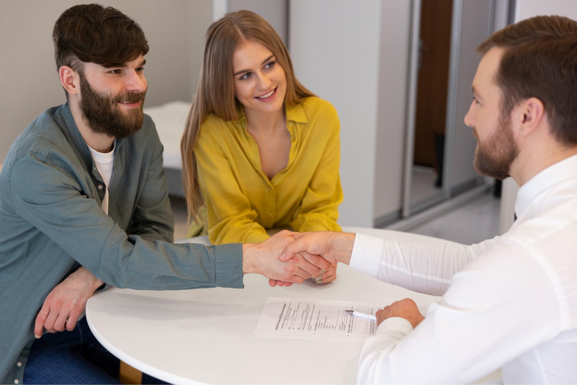 male-real-estate-agent-doing-business-showing-house-potential-buying-couple